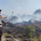 Petugas kepolisian melakukan patroli pencegahan kebakaran hutan dan lahan di wilayah Kubu Raya.