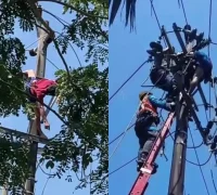 Petugas PLN mengevakuasi pria yang diduga hendak mencuri kabel setelah tersengat listrik di Jalan Purnama 2, Pontianak Selatan.