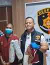 Tersangka MD, pria 22 tahun pelaku penganiayaan balita, saat diamankan polisi di Polresta Pontianak.
