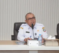 Plt Kepala Dinas Komunikasi dan Informatika Kota Pontianak Yusnaldi saat membuka sosialisasi kebijakan teknologi informasi dan komunikasi (TIK) dan Manajemen Keamanan Informasi.