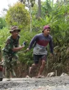 Satgas TMMD bersama warga menarik arko berisi material saat melintasi medan terjal untuk mendukung pengecoran jalan di Desa Watuduwur, Purworejo.