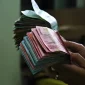 Ilustrasi - BI memperketat pembelian valas di tengah tekanan Dolar AS.
